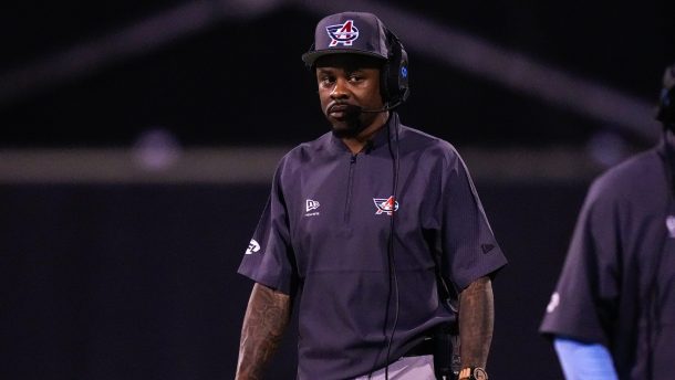 Ted Ginn coaches during a game.