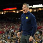 Michigan coach Dusty May.