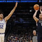 UConn forward Alex Karaban shoots the ball.