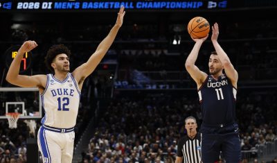 UConn forward Alex Karaban shoots the ball.