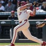 Kuhio Aloy swings a bat.