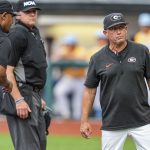 Georgia coach Wes Johnson speaks to umpires.