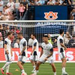 Lionel Messi and Argentina warm up for a match at Auburn's Jordan-Hare Stadium.