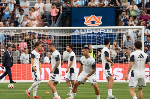 Lionel Messi and Argentina warm up for a match at Auburn's Jordan-Hare Stadium.