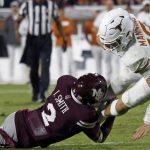 Isaac Smith tackles Arch Manning.