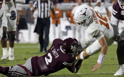 Isaac Smith tackles Arch Manning.