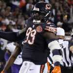 Gervon Dexter Sr. is shown playing for the Chicago Bears.