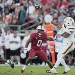 Darian Mensah throws a pass.