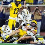 JJ Buchanan catches a Michigan touchdown.