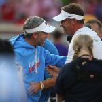 Ole Miss head coach Pete Golding greets LSU coach Lane Kiffin.
