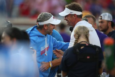Ole Miss head coach Pete Golding greets LSU coach Lane Kiffin.