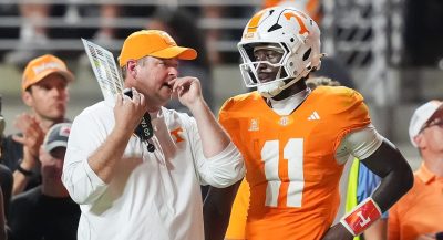 Tennessee QB Faizon Brandon and coach Josh Heupel.