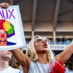 Ole Miss fan with Lane Kiffin "Heaux" sign.