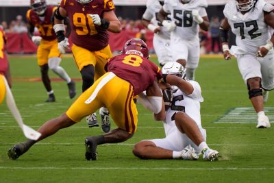 Oregon QB Dante Moore is knocked out by a late hit from USC.