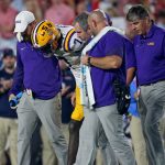 Trey'Dez Green receives assistance off the field.
