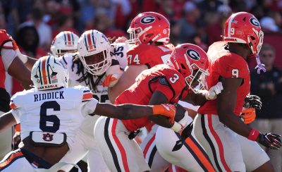Auburn and Georgia play football.