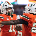 Miami players celebrate beating Florida State.