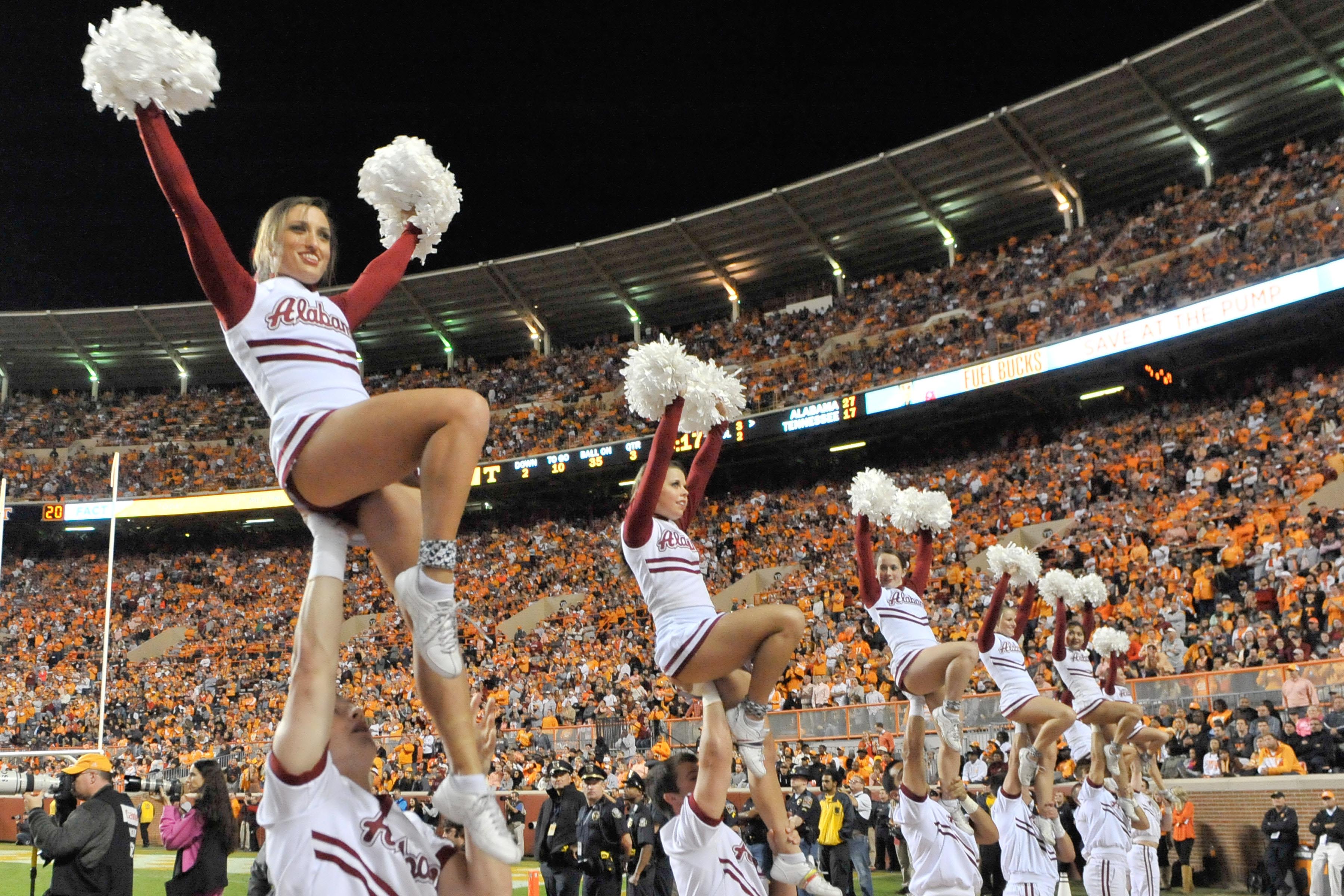 Photo: Alabama cheerleaders show support for LSU fan