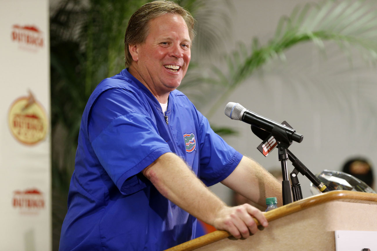 Jim McElwain confirms he&#39;s not the nude man on top of shark in photo  circling the Internet