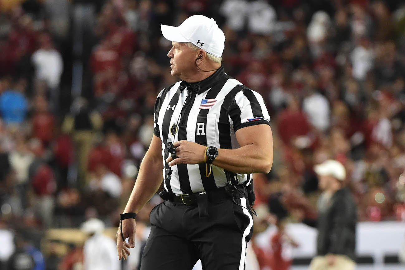 WATCH Jacked referee hilariously swats away football while announcing
