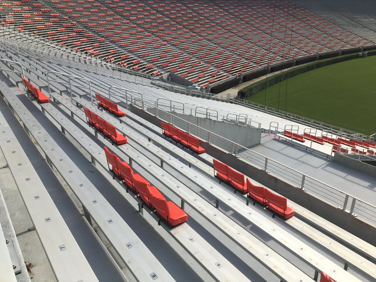 prepares Sanford Stadium's socially distanced seating for the