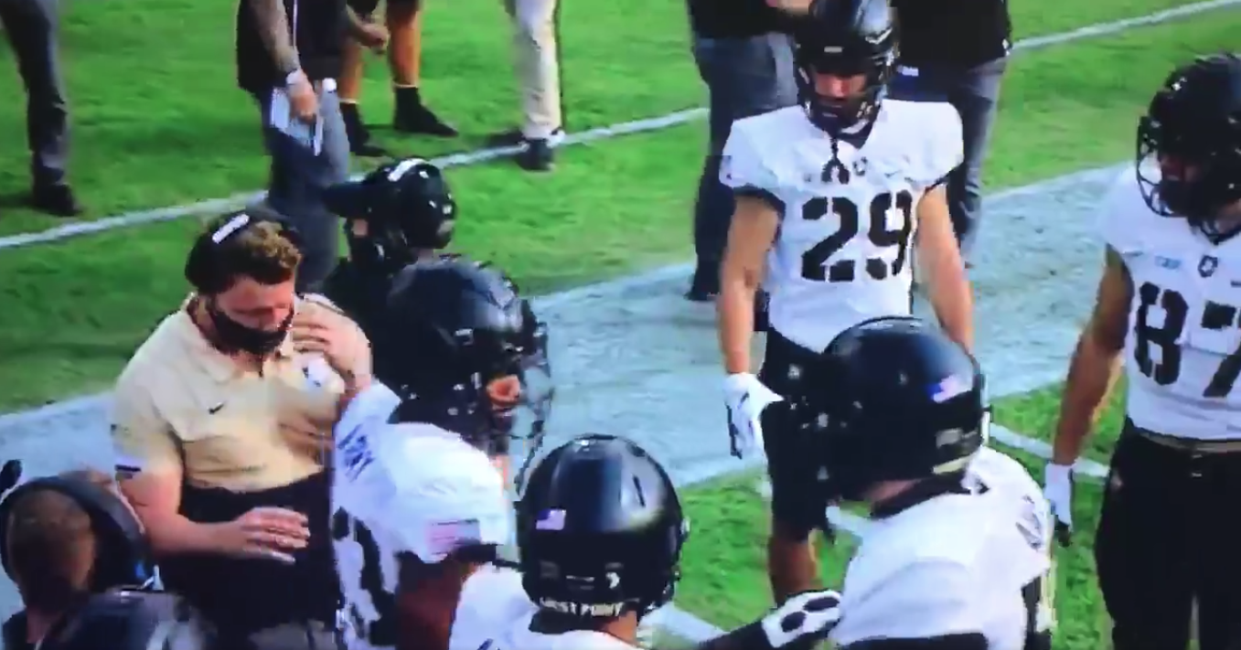 Why? Army player violently headbutts his own coach Why? Army player violently headbutts his own coach