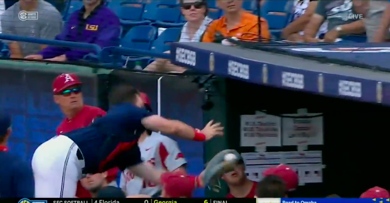 Catch of the year? Ole Miss C Hayden Dunhurst tumbles over dugout