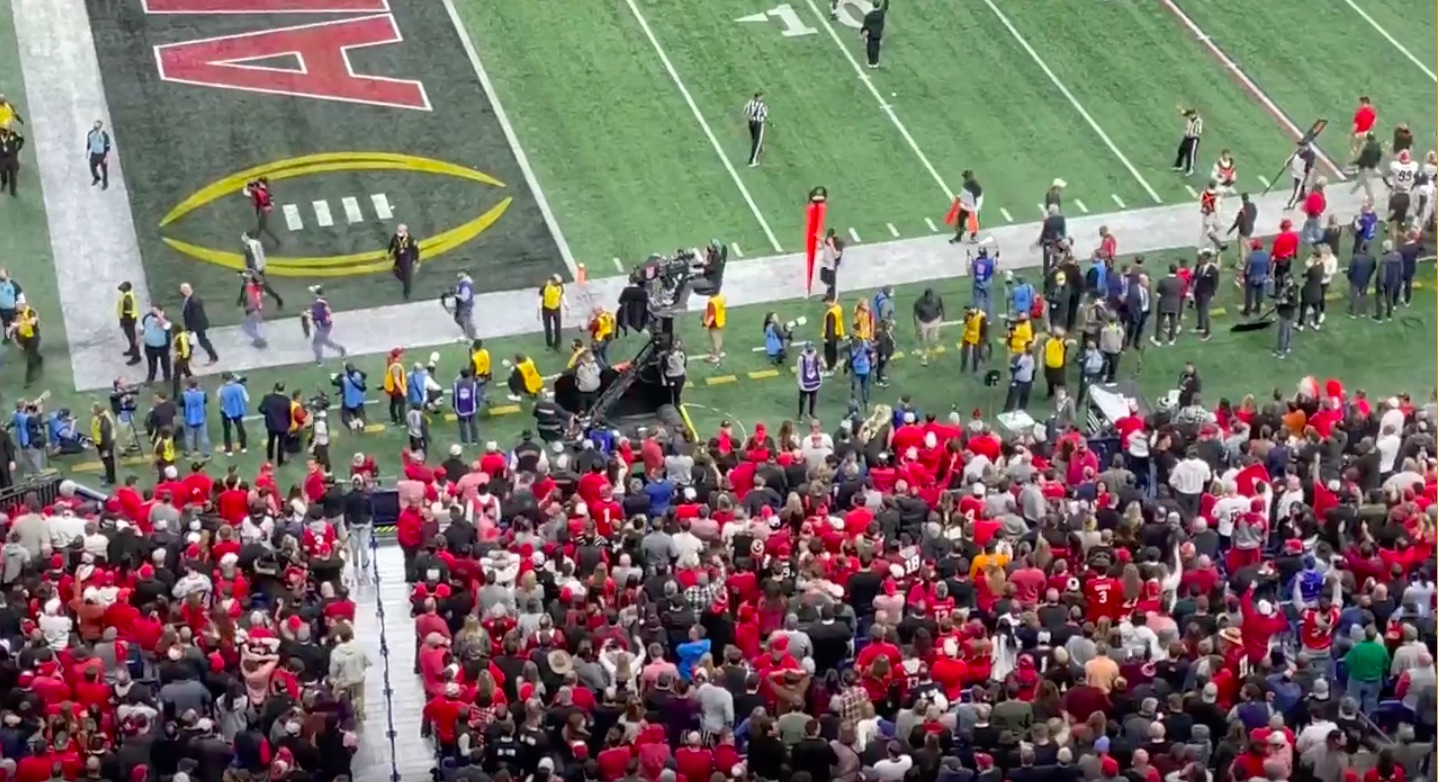 fans throw bottles on field after controversial call in CFP