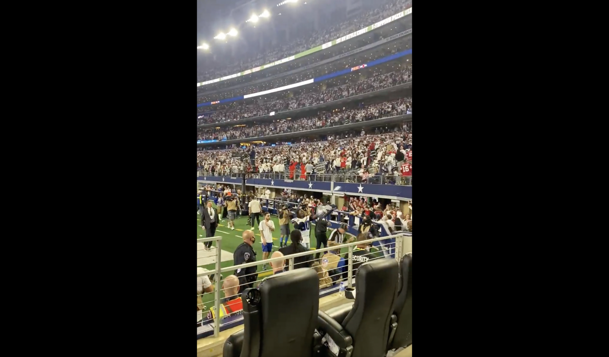 Dallas Cowboys fans show frustration by throwing trash on the field