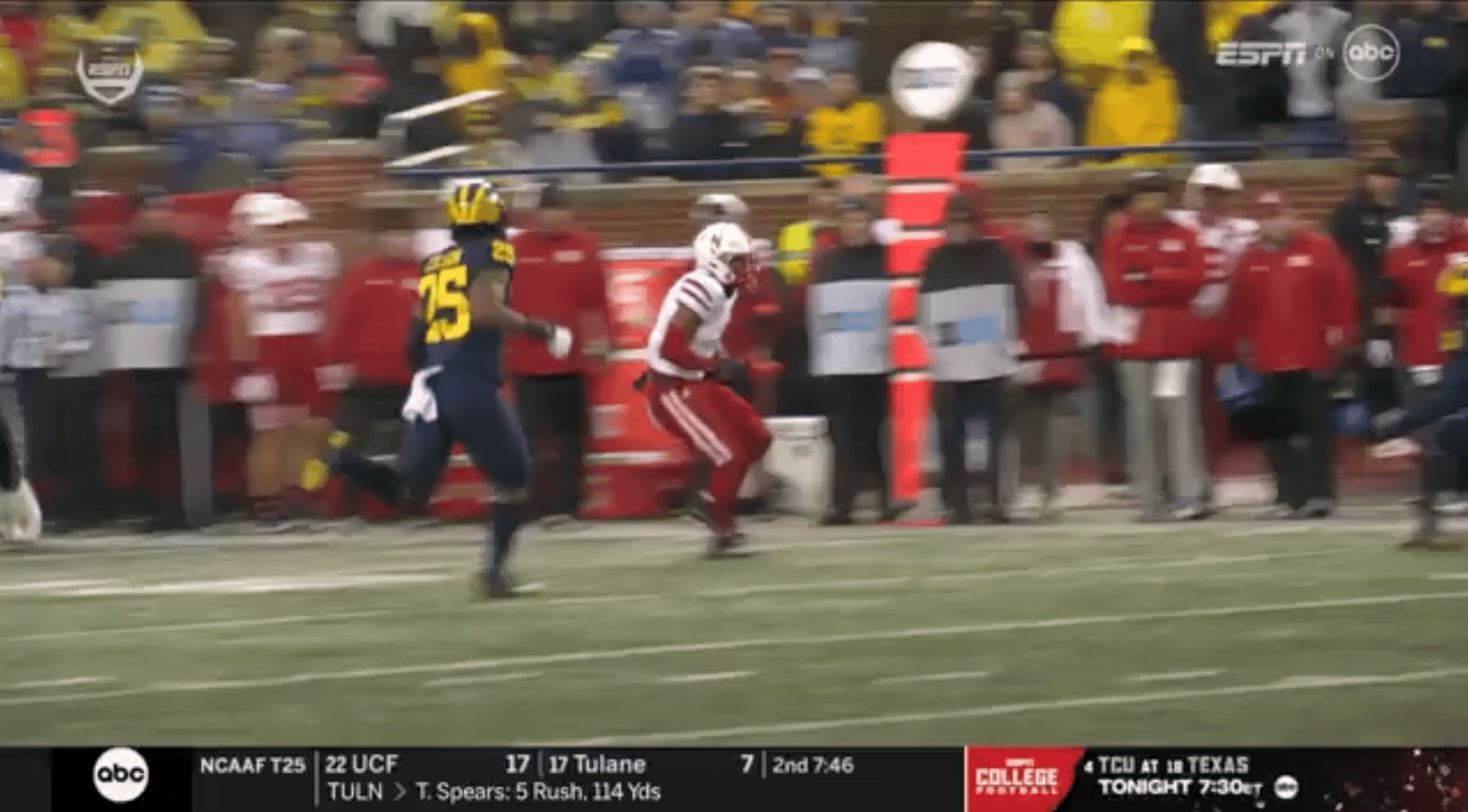 Nebraska player's attempt at a hurdle of a Michigan defender goes
