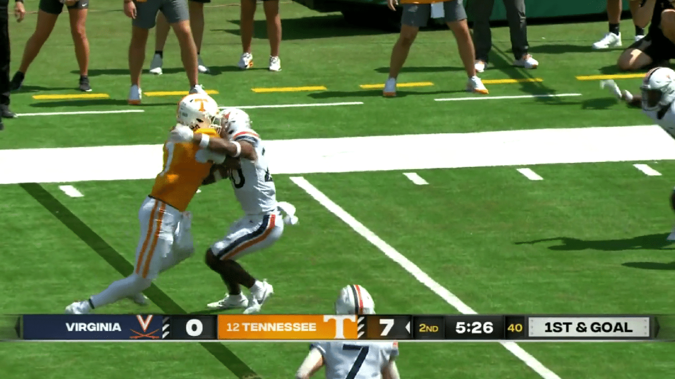 Joe Milton III delivers bruising stiffarm against Virginia defender